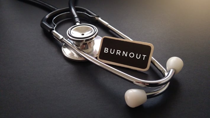 stethoscope with burnout sign